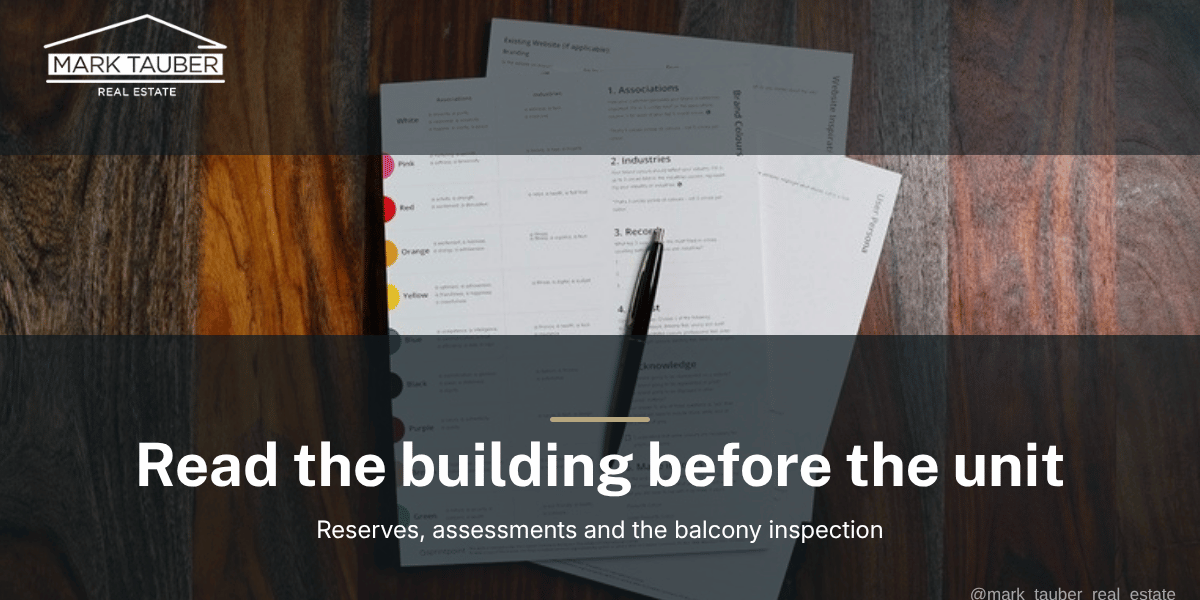 San Mateo County condo HOA document package An HOA document package open on a wooden table with a pen resting on it, the paperwork a San Mateo County condo buyer reviews before writing an offer