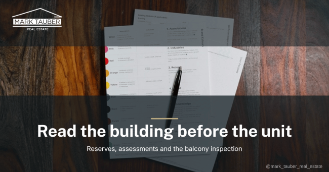 An HOA document package open on a wooden table with a pen resting on it, the paperwork a San Mateo County condo buyer reviews before writing an offer